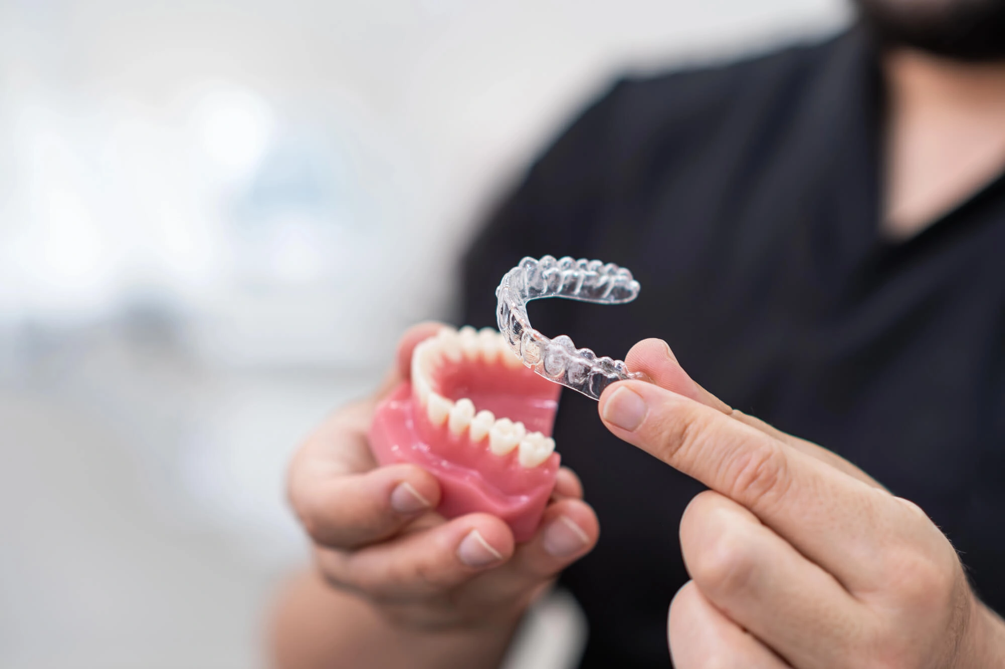 Dentist showing aligners cosmetic dentistry new smyrna beach fl