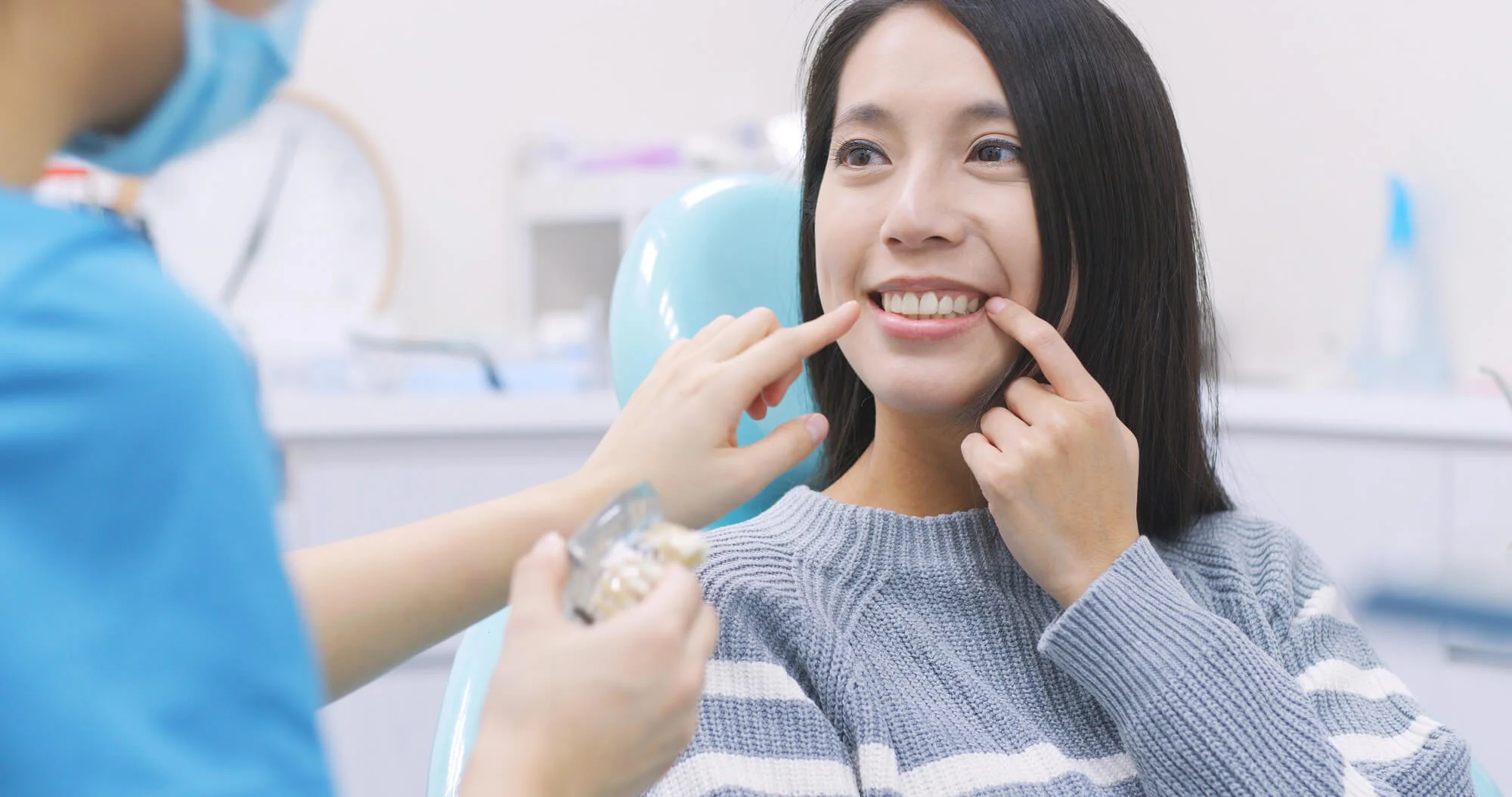 Patient smiling after dental implants in New Smyrna Beach FL.