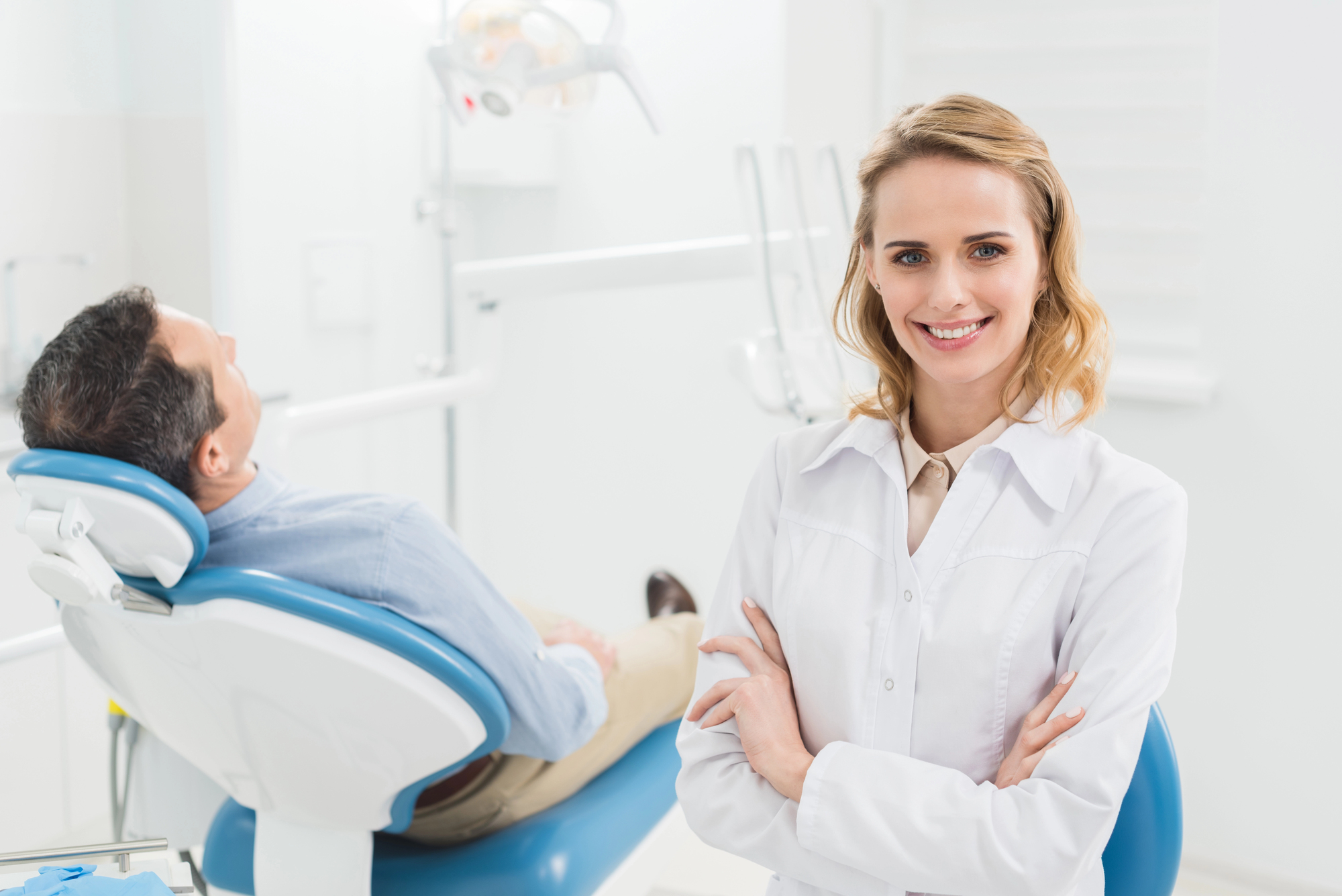 Friendly cosmetic dentist in Edgewater with a patient.