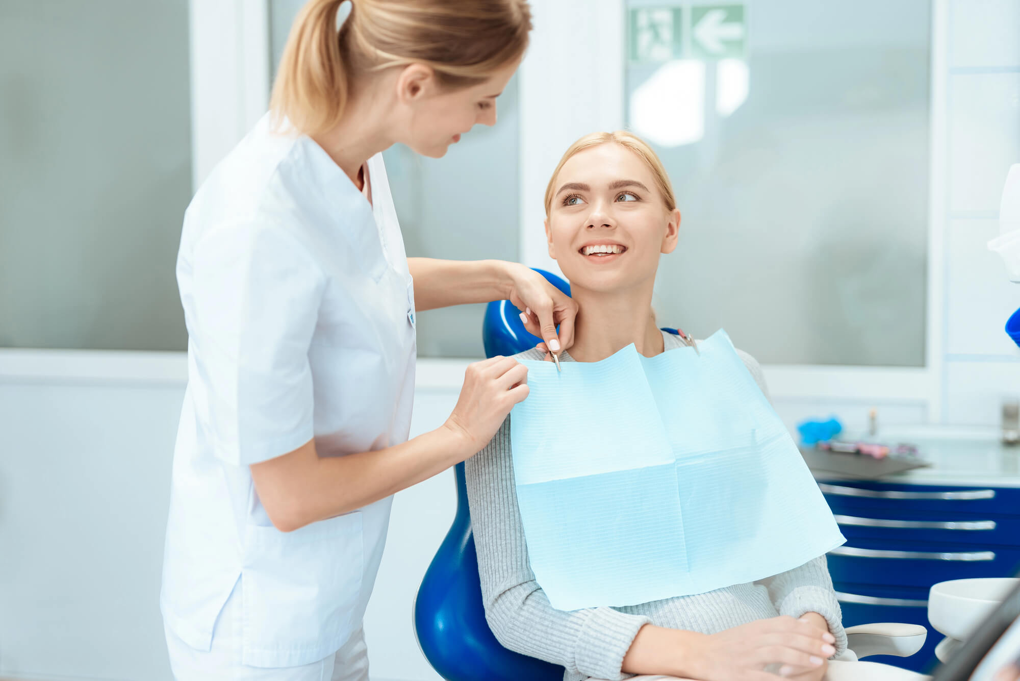 dentist and patient discussing cosmetic dentistry new smyrna beach fl